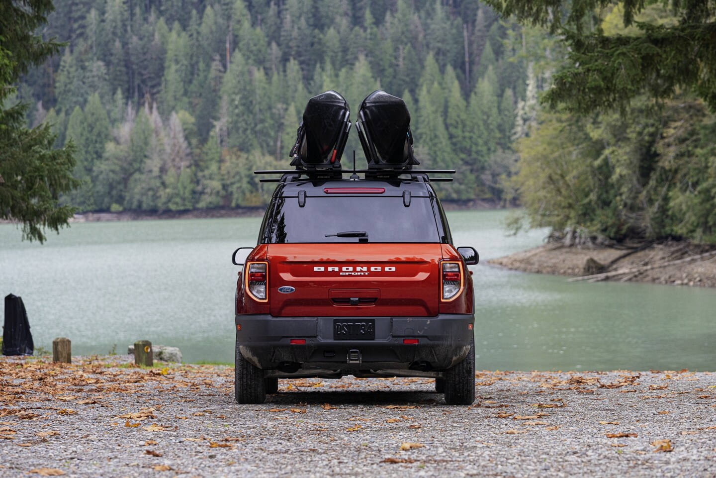 A 2024 Ford Bronco Sport overlooking a lake surrounded by trees