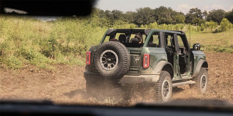 Green Ford Bronco offroading