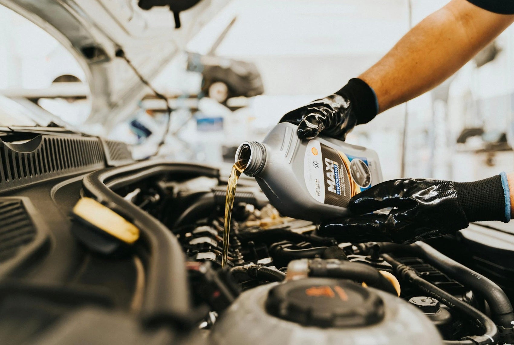 Oil being added to Ford Quick Lane vehicle in Asheville NC